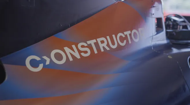 Constructor logo on the side of the race car